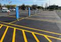 painting white yellow parking lot lines with instant dry traffic paint