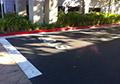 Red durable non fading parking lot fire lane curb white stop bar paint.