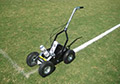 Two large can aerosol soccer field line striping machine paint.