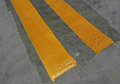 Adhesive primer thermoplastic traffic line marking paint.