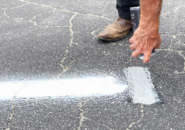 marking paint with reflective glass beads for safety.