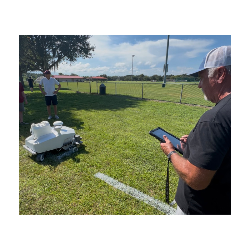 soccer football athletic fields complex painted with robots controlled with phone tablet gps uploaded memory for storage for next painting.