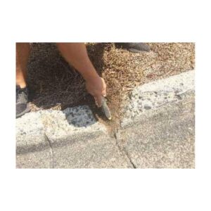 Wire Brush To Remove Grass Dirt Debri Before Patching Damaged Broken Areas On Concrete Curbs.