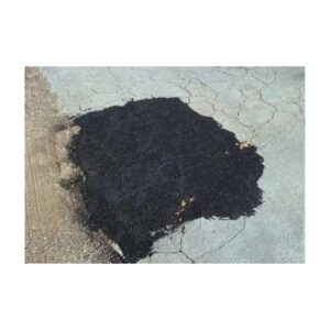 Black Liquid Pavement Sealer Applied On Gray Surface