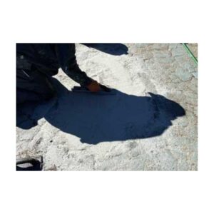 Hand Pouring Thick Black Durapave Liquid Onto A Rough Surface