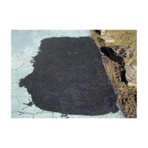 Patch Of Dark Black Asphalt Showing Fresh Pavement Repair