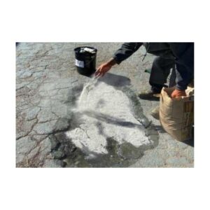Workers Applying Patch To Cracked Pavement Surface