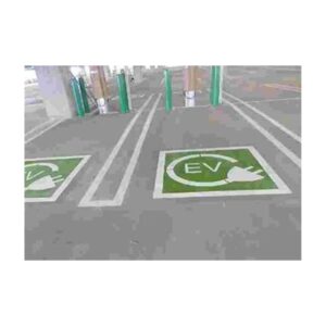 Green Ev Charging Station Symbols Painted In Designated Parking Spaces