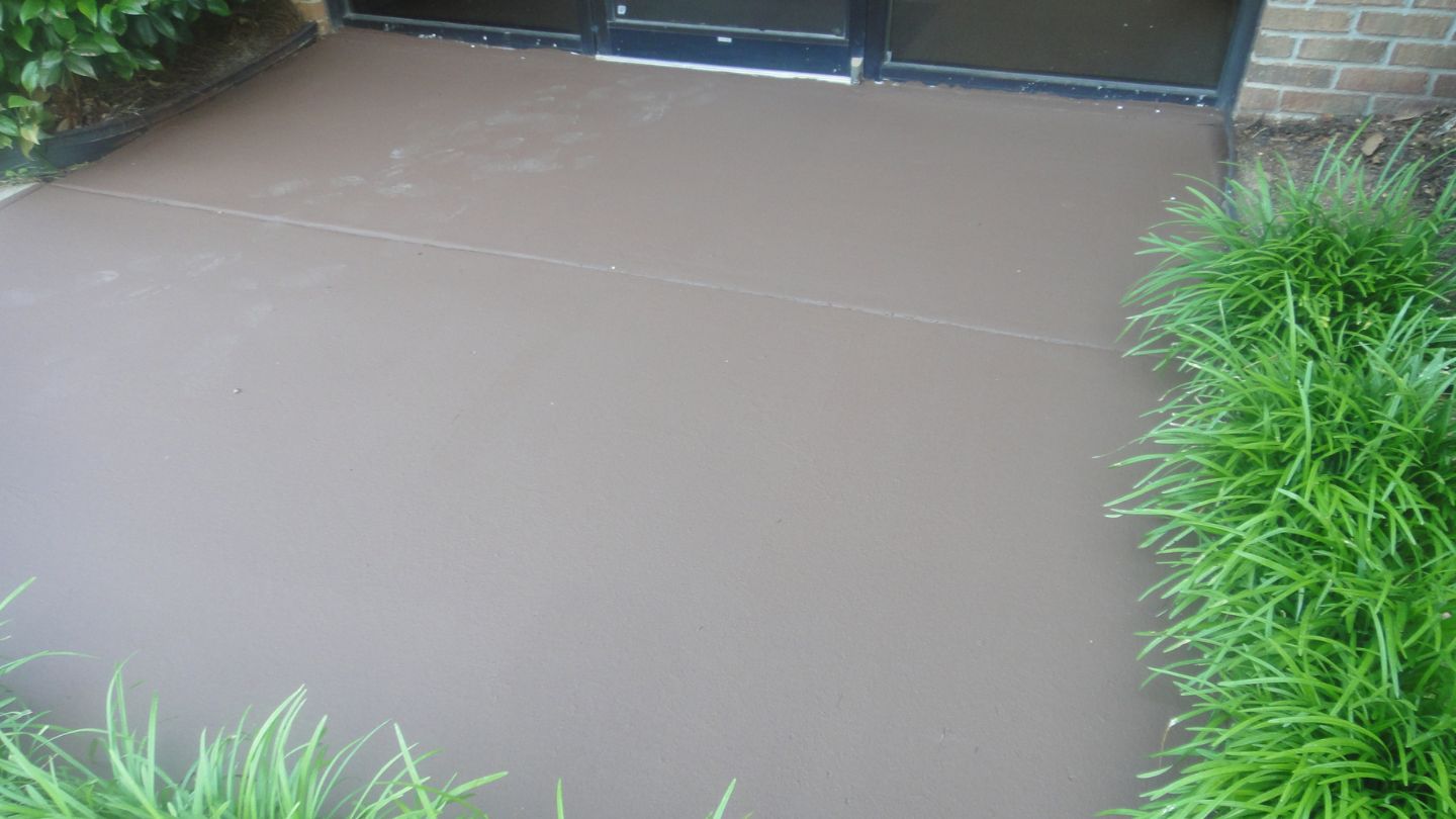 Freshly Painted Concrete Sidewalk With Grass
