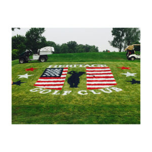 Painted Heritage Golf Club flag logo applied to a golf course using a custom stencil