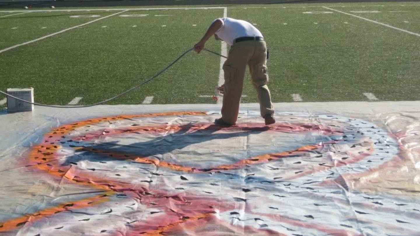 incorporating custom logo stencils into athletic field design