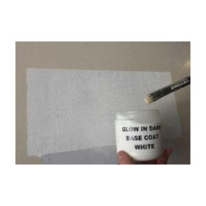 Brush Applying Phosphorescent Glow Pigment On White Surface