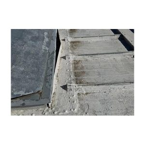 Close-Up Of Sealed Leak On Old Concrete Roof