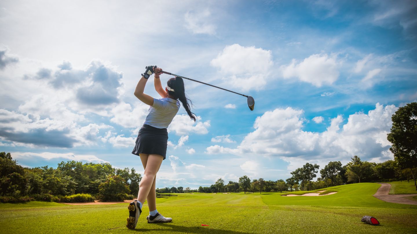  Person Swinging A Golf Club On A Course 