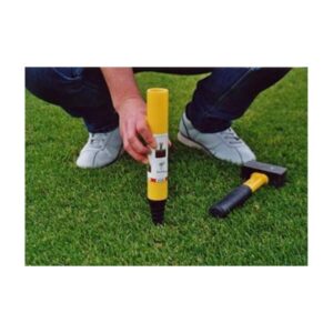 Placing Install Plastic Marker In Gound Of Athletic Field.