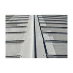Waterproof Sealant Applied To Bolts And Seams On A Metal Roof