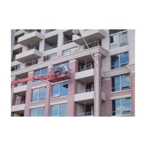 pray Application Of Heat IR Reflecting Brick Red Concrete Coating On Apartment Building.