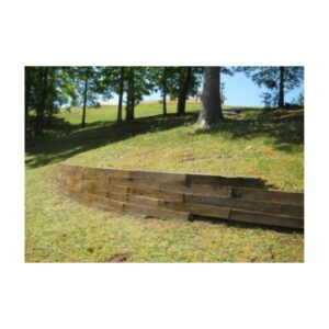 Wooden Deck With Natural Stain Surrounded By Trees And Grass