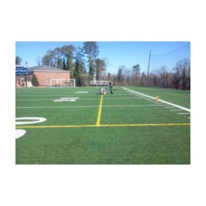 Painting durable removable yellow lacrosse lines on synthetic field turf.