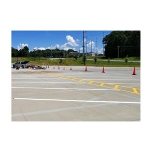 Outdoor Surface With Newly Painted Parking Lot Stripes And Cones