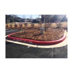 Landscaped Island With Red Curb Marking In A Parking Lot